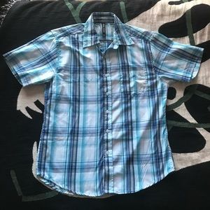 Blue plaid short sleeve button up shirt. Bright blue, dark blue, and white.